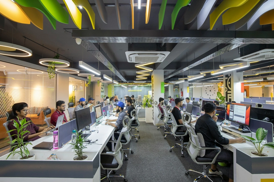 A bright open workspace with people working together